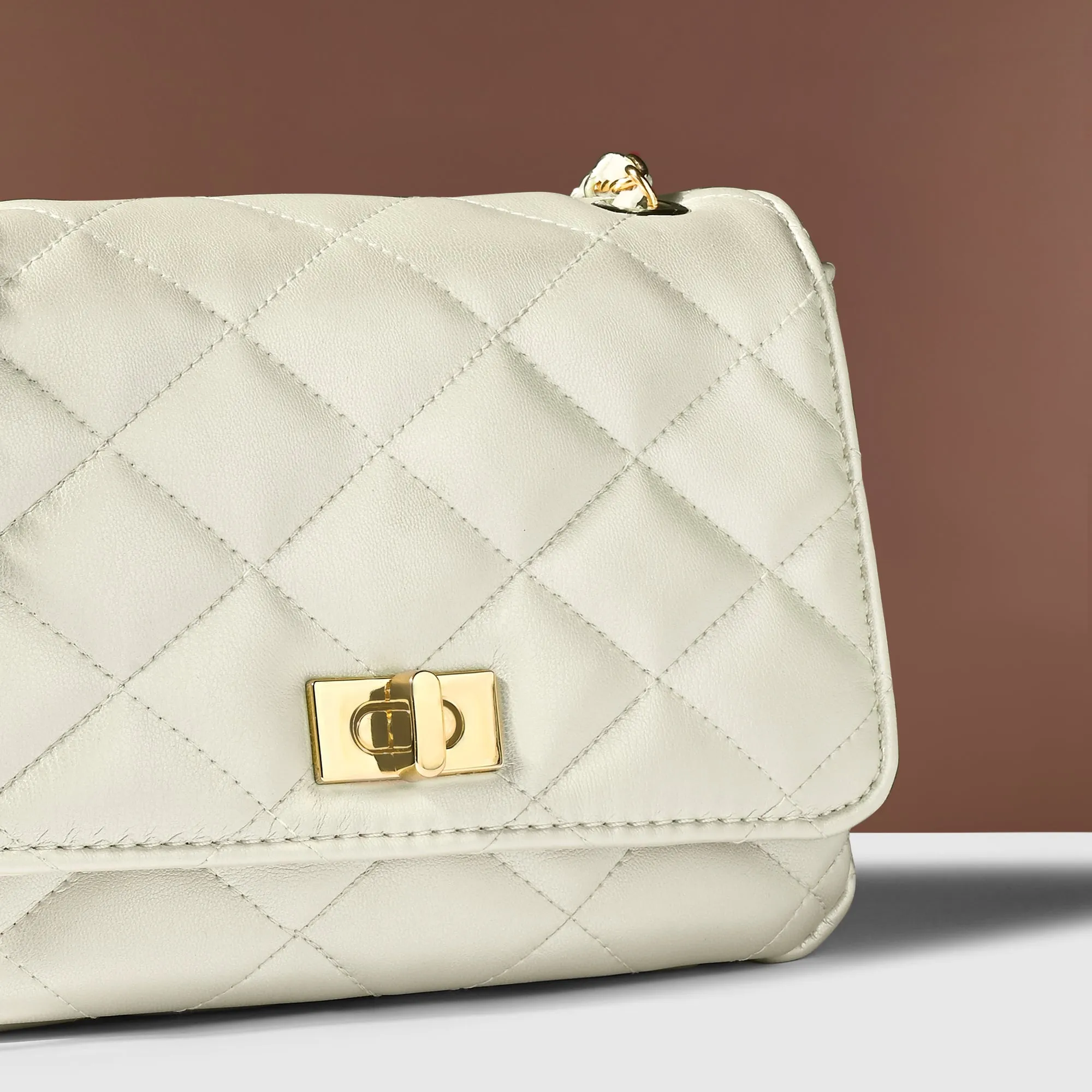 Accessorize London Women's White Quilted Twistlock Sling Bag